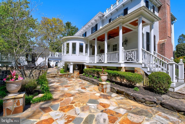 3634 Chain Bridge Rd, Fairfax, VA 22030 - view of front of home featuring stairs, a porch, and a ceiling fan