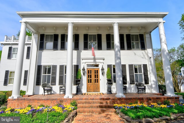 3634 Chain Bridge Rd, Fairfax, VA 22030 - greek revival house with a porch and a balcony