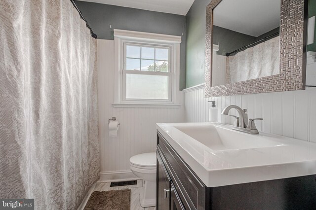 2811 Green St, Claymont, DE 19703 - bathroom featuring vanity, wainscoting, and a shower with shower curtain