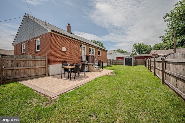 2811 Green St, Claymont, DE 19703 - fenced backyard with a storage unit and a patio