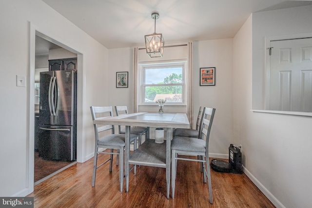 2811 Green St, Claymont, DE 19703 - dining area featuring wood finished floors and a chandelier