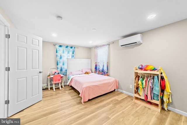 510 Sutherland Rd, Ewing, NJ 08618 - bedroom with an AC wall unit, light wood-type flooring, and recessed lighting