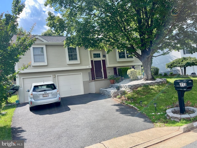313 Samantha Dr, Sterling, VA 20164 - view of front of house with driveway and an attached garage
