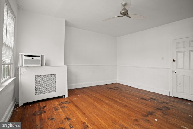 7019 Algard St, Philadelphia, PA 19135 - spare room featuring ceiling fan, hardwood / wood-style flooring, and an AC wall unit