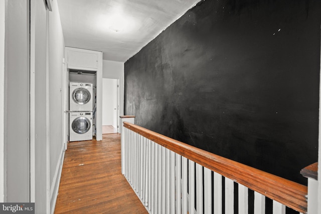 7019 Algard St, Philadelphia, PA 19135 - hall featuring estacked washer and dryer, wood finished floors, and an upstairs landing
