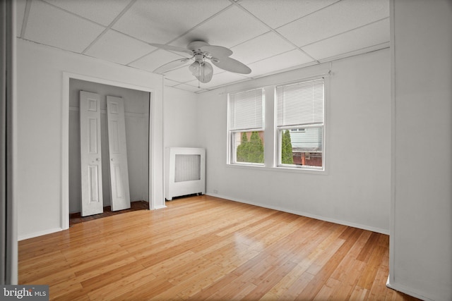 7019 Algard St, Philadelphia, PA 19135 - unfurnished bedroom featuring a drop ceiling, light wood-style flooring, and ceiling fan