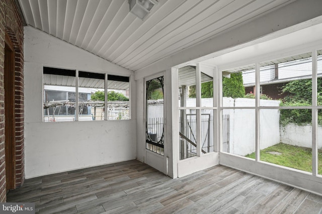 7019 Algard St, Philadelphia, PA 19135 - unfurnished sunroom with lofted ceiling and wood finished floors