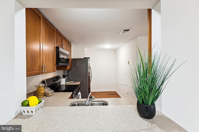 24 Whitechurch Ct, Germantown, MD 20874 - kitchen featuring appliances with stainless steel finishes and brown cabinets
