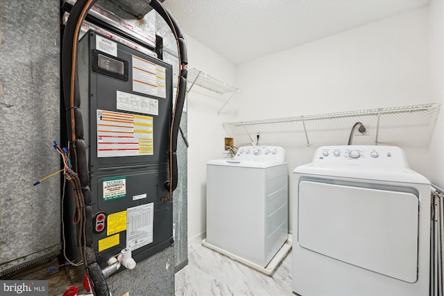 24 Whitechurch Ct, Germantown, MD 20874 - laundry area with separate washer and dryer, marble look tile flooring, and heating unit