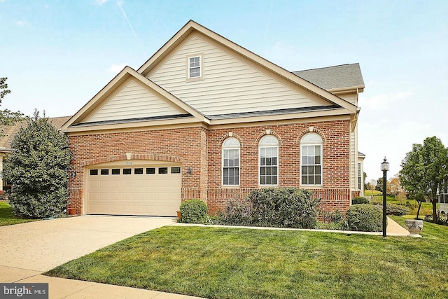 13736 Charismatic Way, Gainesville, VA 20155 - view of front facade with brick siding, a front yard, concrete driveway, and an attached garage