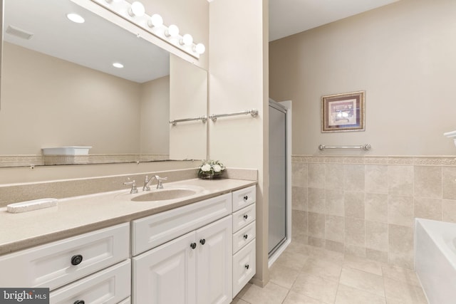 1324 W Chester Pike Unit 105, West Chester, PA 19382 - full bath featuring tile patterned flooring, vanity, a garden tub, a stall shower, and tile walls