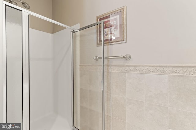 1324 W Chester Pike Unit 105, West Chester, PA 19382 - bathroom with a shower stall and wainscoting