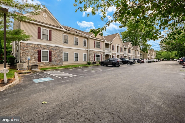 1324 W Chester Pike Unit 105, West Chester, PA 19382 - view of building exterior featuring uncovered parking and a residential view