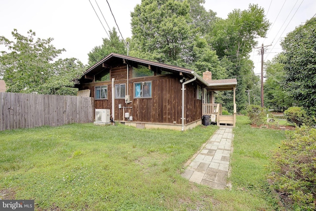 638 Los Alamos Ln, Lusby, MD 20657 - view of property exterior with a chimney and a cooling unit