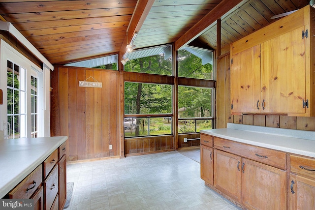 638 Los Alamos Ln, Lusby, MD 20657 - kitchen featuring wood walls, light countertops, light flooring, and wooden ceiling