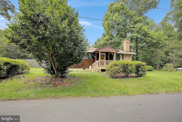 638 Los Alamos Ln, Lusby, MD 20657 - view of front facade with a chimney