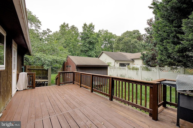 638 Los Alamos Ln, Lusby, MD 20657 - deck featuring an outdoor structure and view of scattered trees