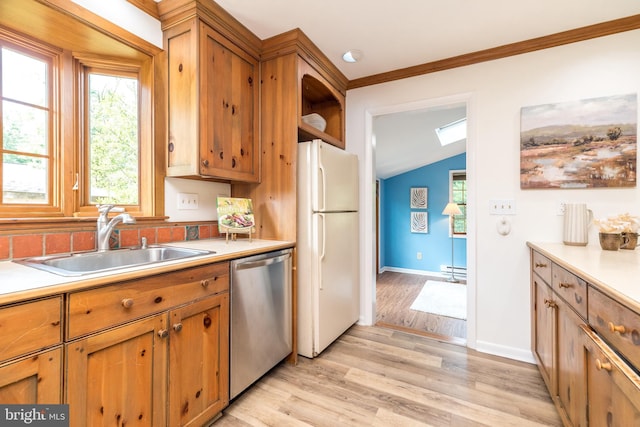 559 Maple Ave, Doylestown, PA 18901 - kitchen with freestanding refrigerator, dishwasher, light countertops, light wood-style floors, and vaulted ceiling