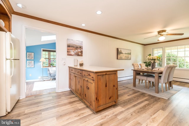 559 Maple Ave, Doylestown, PA 18901 - kitchen featuring freestanding refrigerator, ornamental molding, light wood-style flooring, a baseboard heating unit, and recessed lighting