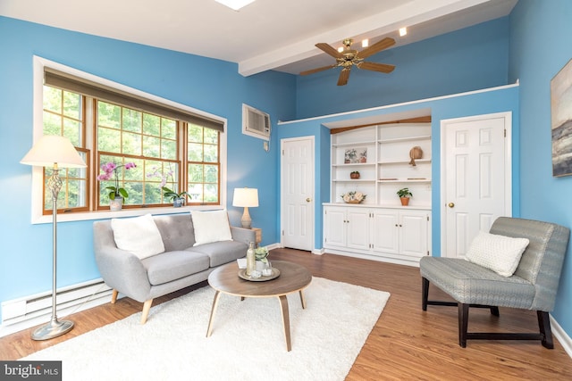 559 Maple Ave, Doylestown, PA 18901 - living area with beamed ceiling, a baseboard radiator, wood finished floors, a ceiling fan, and a wall mounted AC