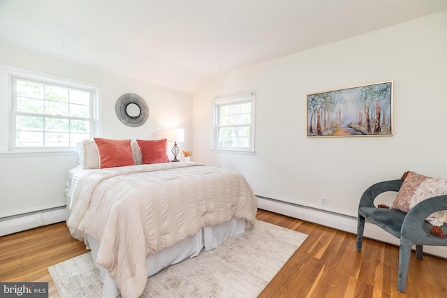 559 Maple Ave, Doylestown, PA 18901 - bedroom featuring a baseboard radiator, lofted ceiling, wood finished floors, and a baseboard heating unit