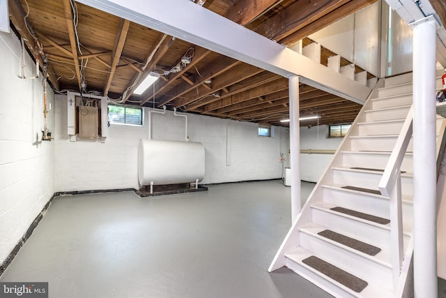 559 Maple Ave, Doylestown, PA 18901 - basement featuring heating fuel, concrete block wall, stairs, and electric panel
