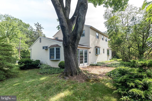 559 Maple Ave, Doylestown, PA 18901 - view of home's exterior with a yard and a wall unit AC