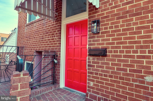 4220 Fort Dupont St SE, Washington, DC 20020 - doorway to property featuring brick siding and a garage