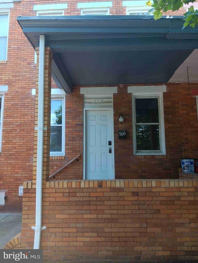 509 N Highland Ave, Baltimore, MD 21205 - view of exterior entry featuring brick siding