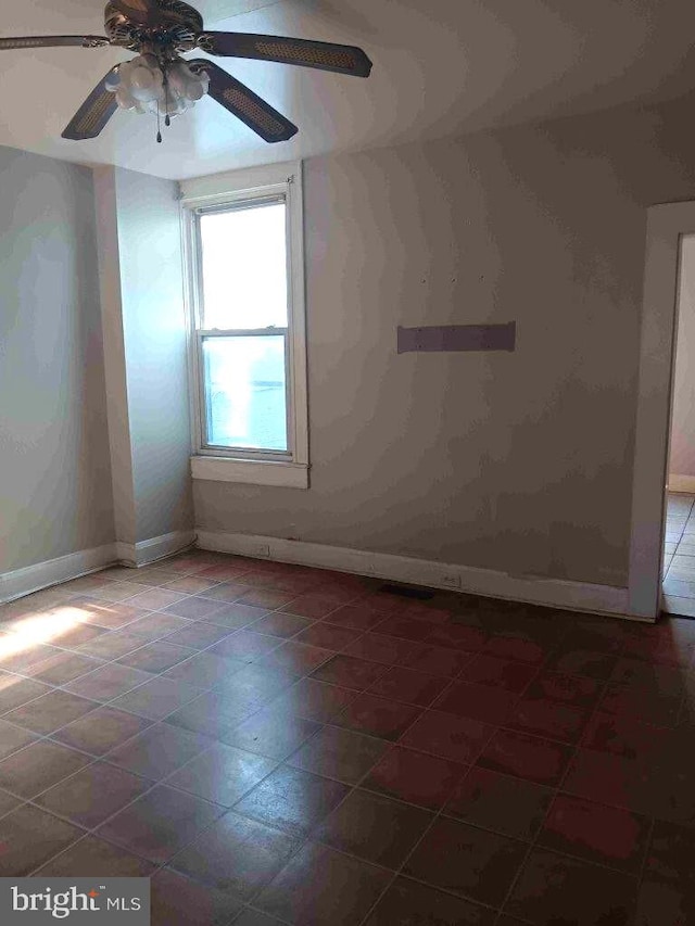 509 N Highland Ave, Baltimore, MD 21205 - tiled spare room with baseboards and ceiling fan