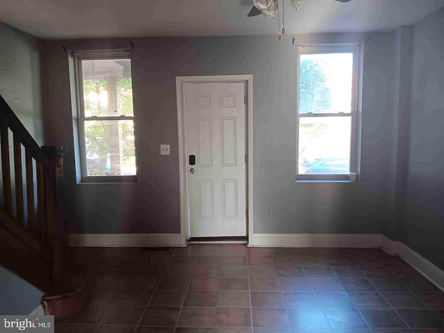 509 N Highland Ave, Baltimore, MD 21205 - tiled foyer featuring healthy amount of natural light, a ceiling fan, and stairs