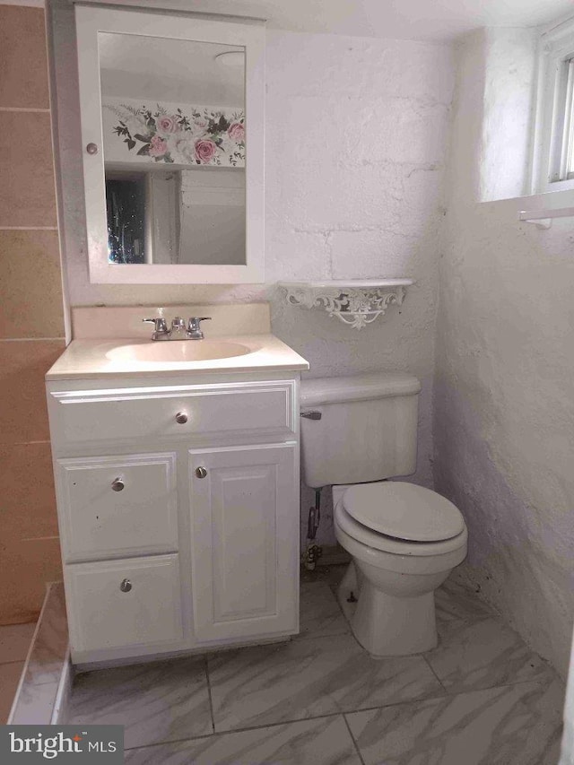 509 N Highland Ave, Baltimore, MD 21205 - bathroom featuring marble finish floors and vanity