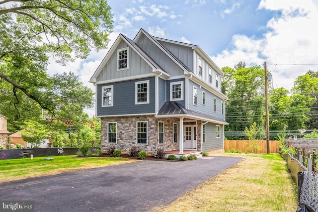 45 Orchard Ln, Berwyn, PA 19312 - craftsman house featuring a porch, board and batten siding, stone siding, and driveway