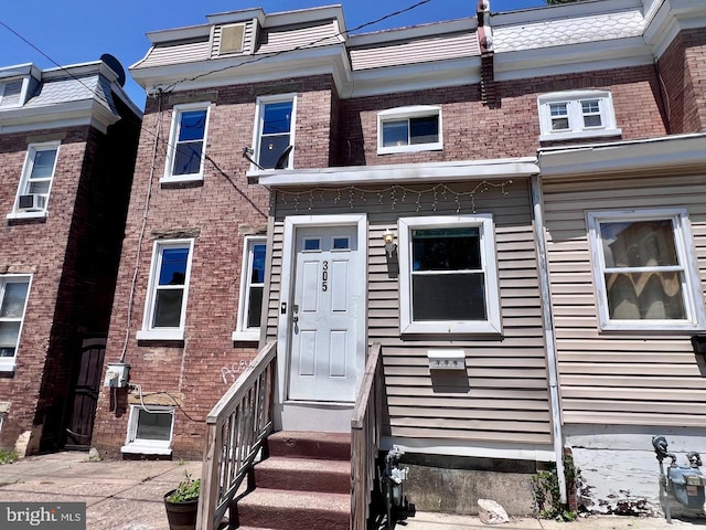 305 Delamore Pl, Wilmington, DE 19805 - townhome / multi-family property featuring entry steps, brick siding, and cooling unit
