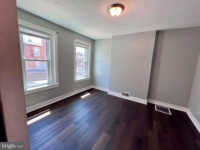 305 Delamore Pl, Wilmington, DE 19805 - unfurnished room with baseboards and dark wood-style floors