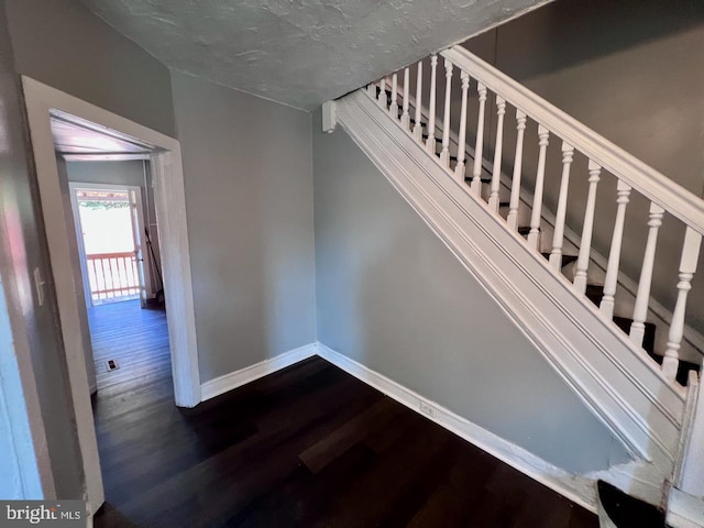 305 Delamore Pl, Wilmington, DE 19805 - staircase with wood finished floors and a textured ceiling