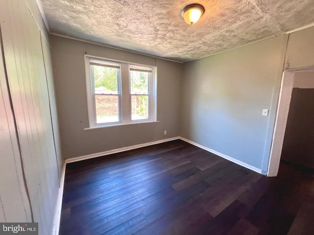 305 Delamore Pl, Wilmington, DE 19805 - spare room featuring dark wood-style flooring and a textured ceiling