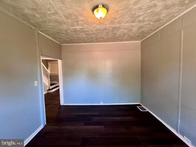 305 Delamore Pl, Wilmington, DE 19805 - spare room featuring wood finished floors, a textured ceiling, and a decorative wall