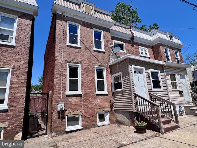 305 Delamore Pl, Wilmington, DE 19805 - back of property with a gate, entry steps, and brick siding