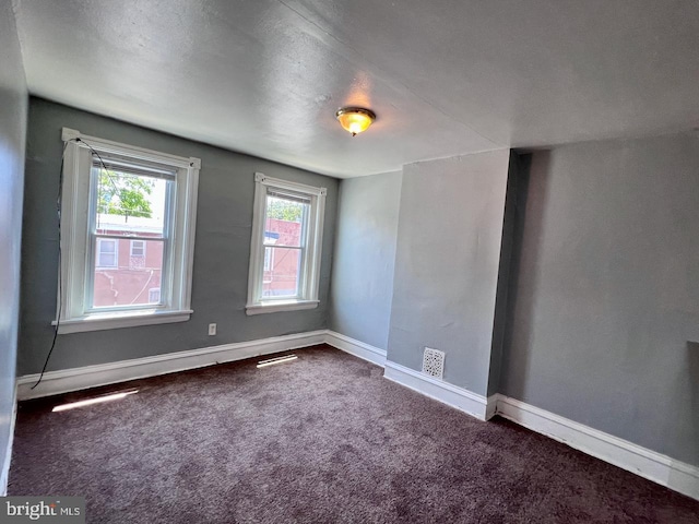 305 Delamore Pl, Wilmington, DE 19805 - spare room featuring dark colored carpet and baseboards