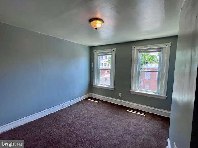 305 Delamore Pl, Wilmington, DE 19805 - empty room with dark colored carpet and baseboards