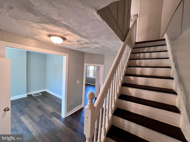 305 Delamore Pl, Wilmington, DE 19805 - stairway featuring wood finished floors and a textured ceiling