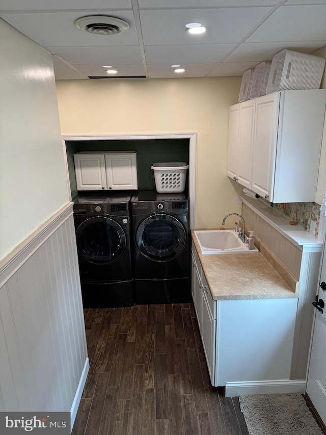 1872 Yingling Dr, Spring Grove, PA 17362 - laundry room with washer and clothes dryer, dark wood finished floors, cabinet space, and a wainscoted wall