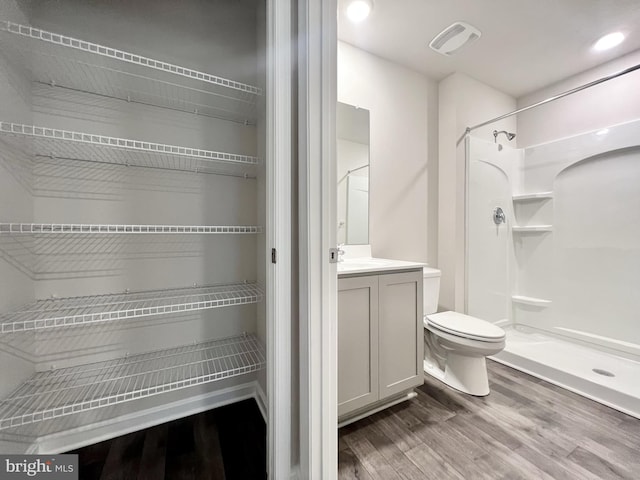 22189 Shorebird Way, Millsboro, DE 19966 - bathroom with wood finished floors, vanity, and a shower