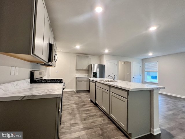 22189 Shorebird Way, Millsboro, DE 19966 - kitchen featuring gray cabinets, appliances with stainless steel finishes, light countertops, dark wood-style floors, and recessed lighting