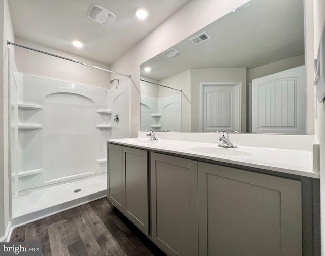 22189 Shorebird Way, Millsboro, DE 19966 - full bath featuring wood finished floors, a shower, and double vanity