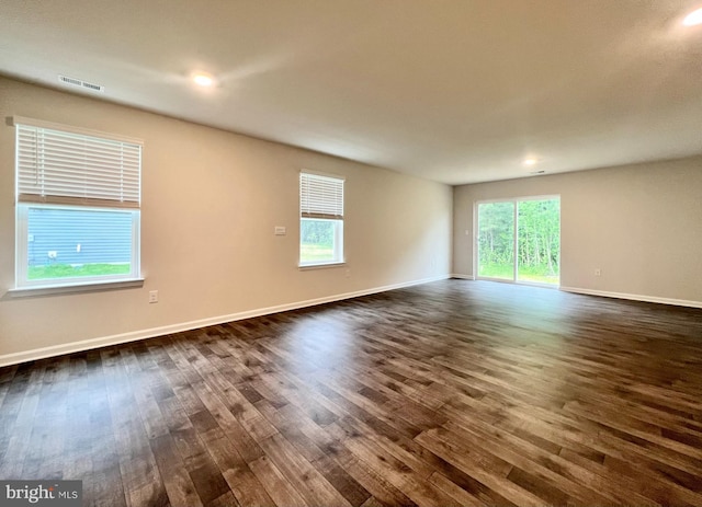 22189 Shorebird Way, Millsboro, DE 19966 - empty room with dark wood finished floors, plenty of natural light, and recessed lighting
