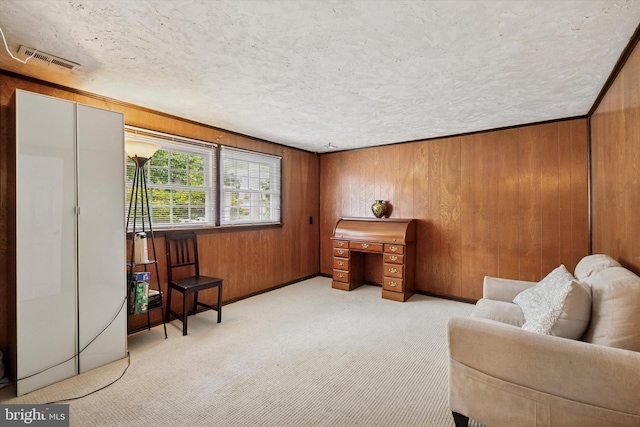 709 Parmentier Rd, Warminster, PA 18974 - living area featuring carpet flooring, wooden walls, and a textured ceiling
