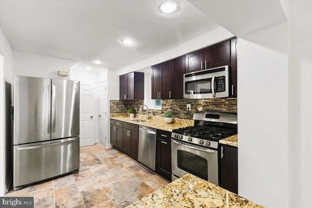 5901 Euclid, Cheverly, MD 20785 - kitchen with appliances with stainless steel finishes, tasteful backsplash, light stone countertops, light stone finish flooring, and recessed lighting