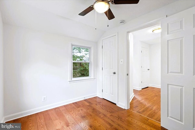 5901 Euclid, Cheverly, MD 20785 - unfurnished bedroom with wood finished floors, vaulted ceiling, and ceiling fan